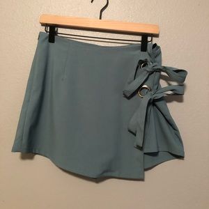 teal skort, tie details on side, size large